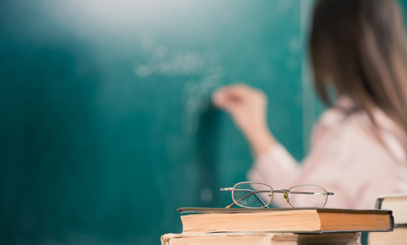 teacher books and glasses closeup